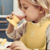 BabyBjorn - Set hranire: farfurie, lingurita, furculita, pahar si bavetica pentru bebe, Powder Yellow - imagine 2